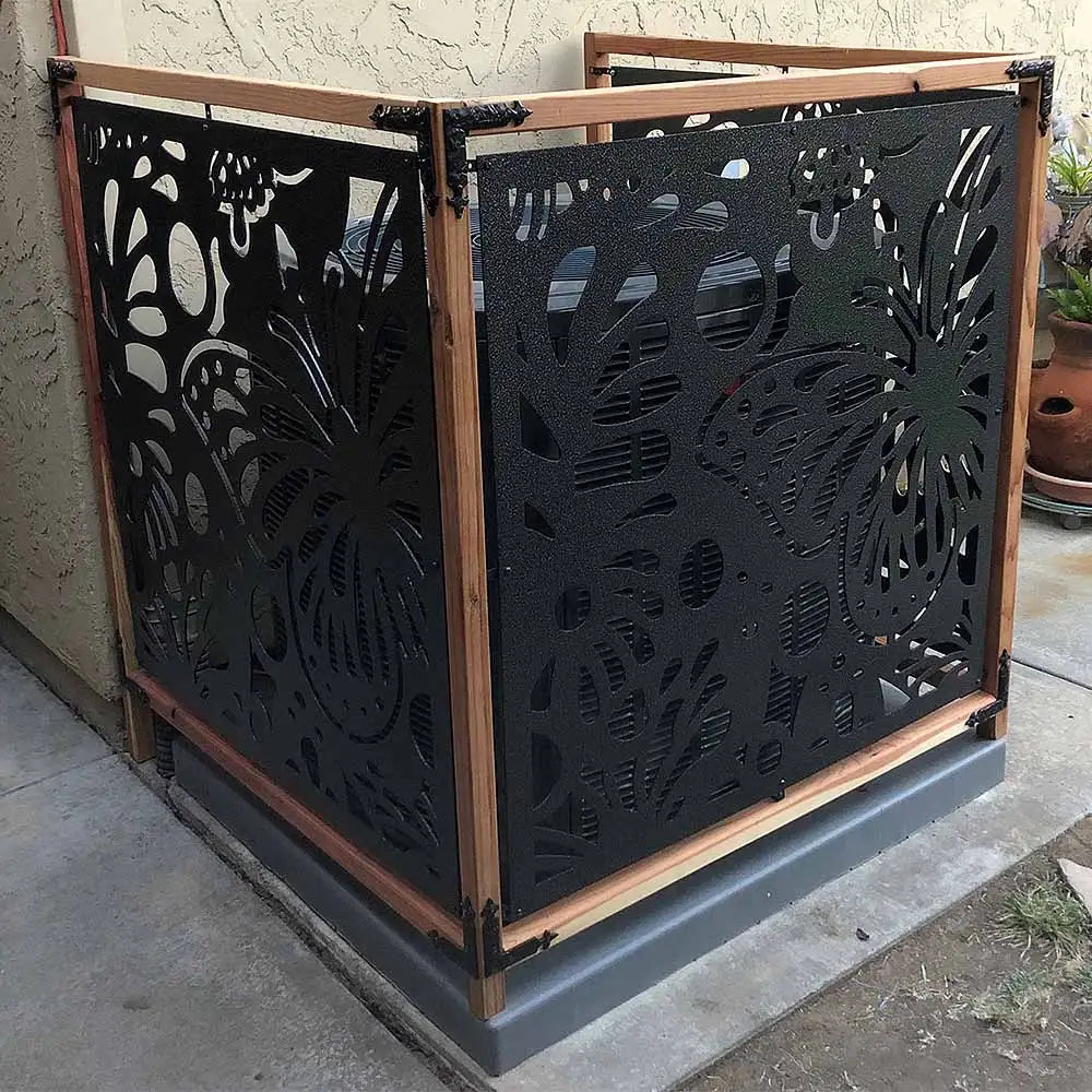 Black metal decorative screen with intricate floral patterns and wooden frame.