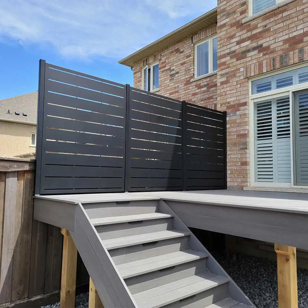 Charcoal gray modern privacy screen with horizontal slats and wooden posts.