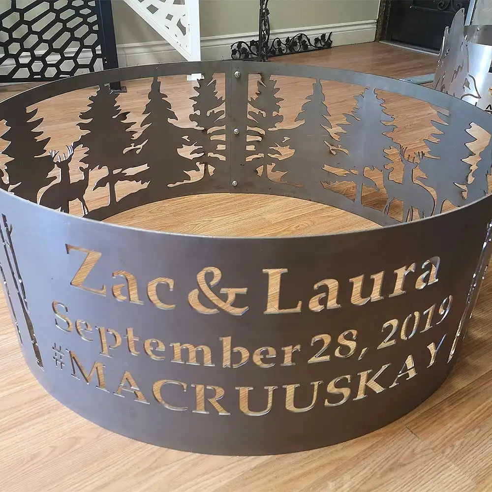 Metal fire pit ring with forest silhouette design, brown