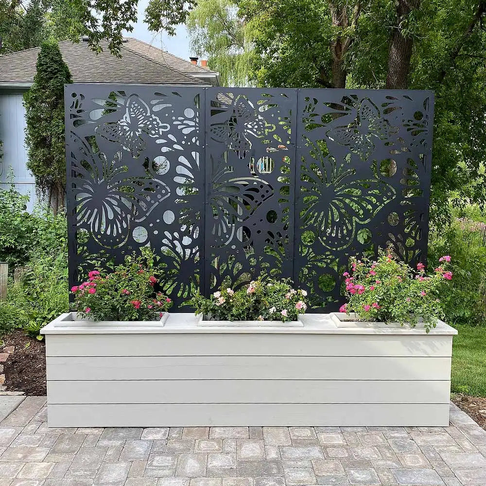 White wooden planter with butterfly design screen